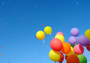 multicolored balloons and confetti